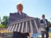 Donald Trump with rendering of ballroom