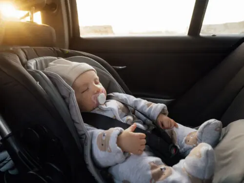 Baby sleeping in an infant car seat
